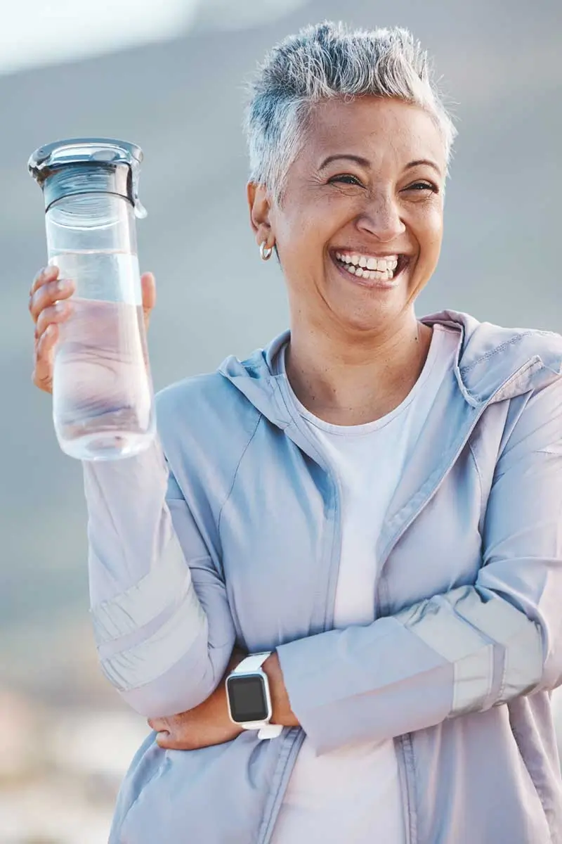 old woman with water bottle